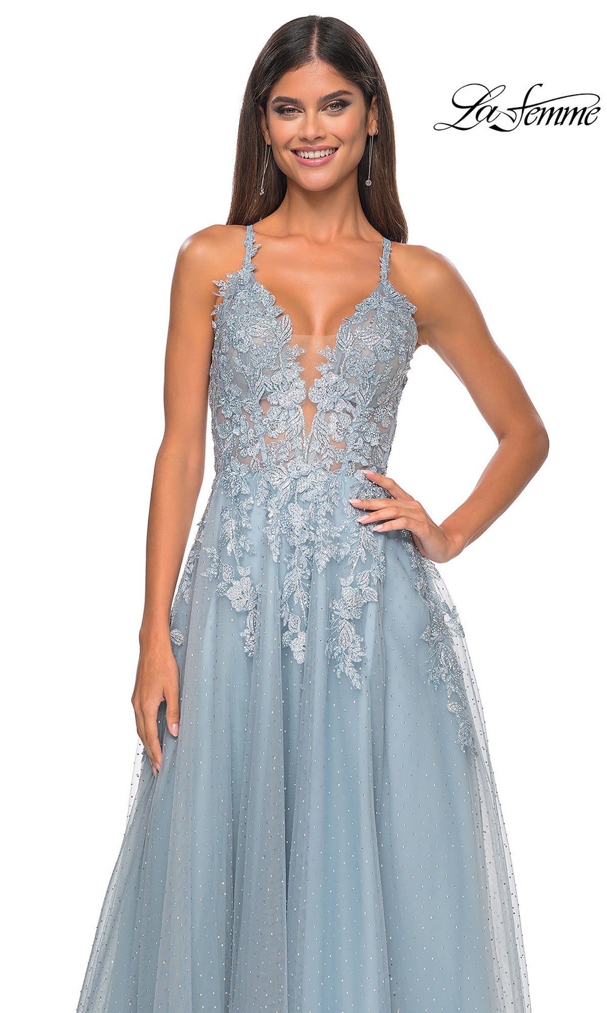 The La Femme Lace-Embroidered Long Prom Dress 32147 features floral lace appliqué on a sheer bodice, thin straps, and a flowing dotted light blue skirt for an elegant look.